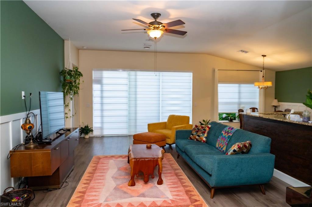 4176 Madison Street Ave Maria, FL 34142 - Photo 8 of 17 a living room with furniture and a large window