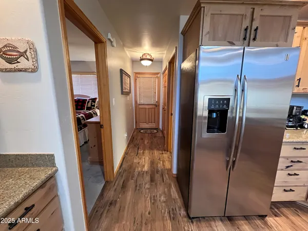 a view of a kitchen from a hallway