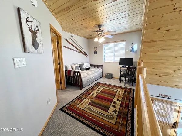 a view of living room with furniture and a rug
