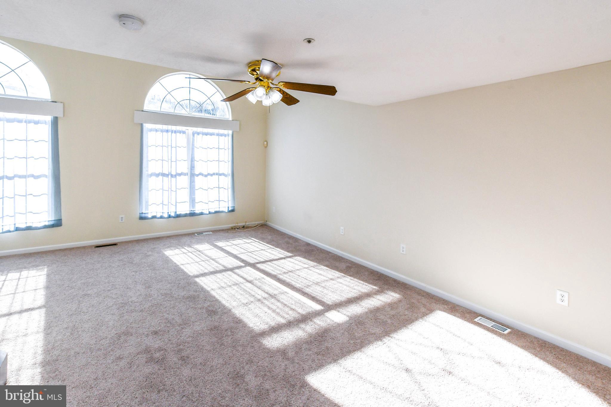 5908 Grenfell Loop Bowie, MD 20720 - Photo 24 of 65 wooden floor in an empty room with a window