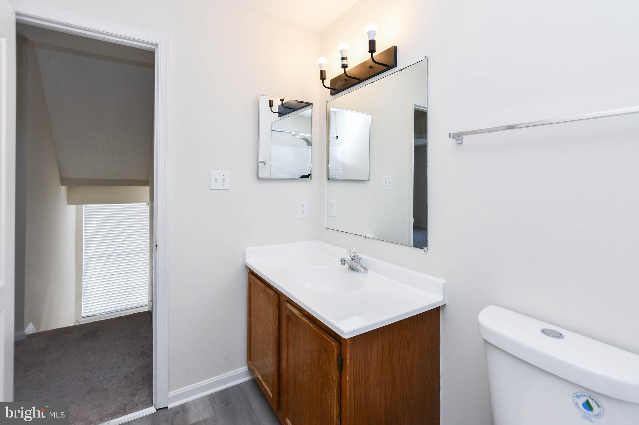 5908 Grenfell Loop Bowie, MD 20720 - Photo 36 of 65 a bathroom with a sink and a toilet