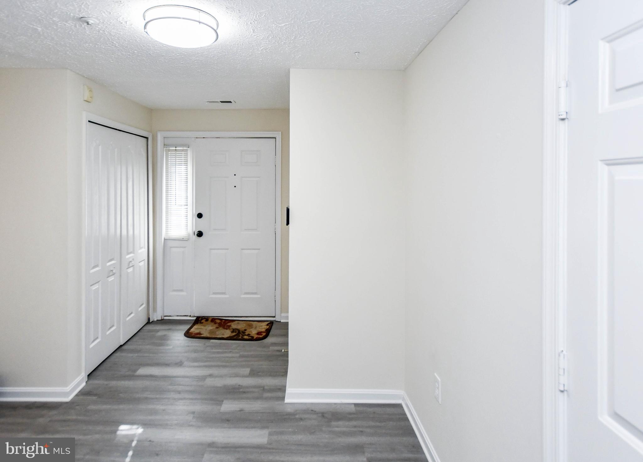 5908 Grenfell Loop Bowie, MD 20720 - Photo 5 of 65 a view of a livingroom with wooden floor
