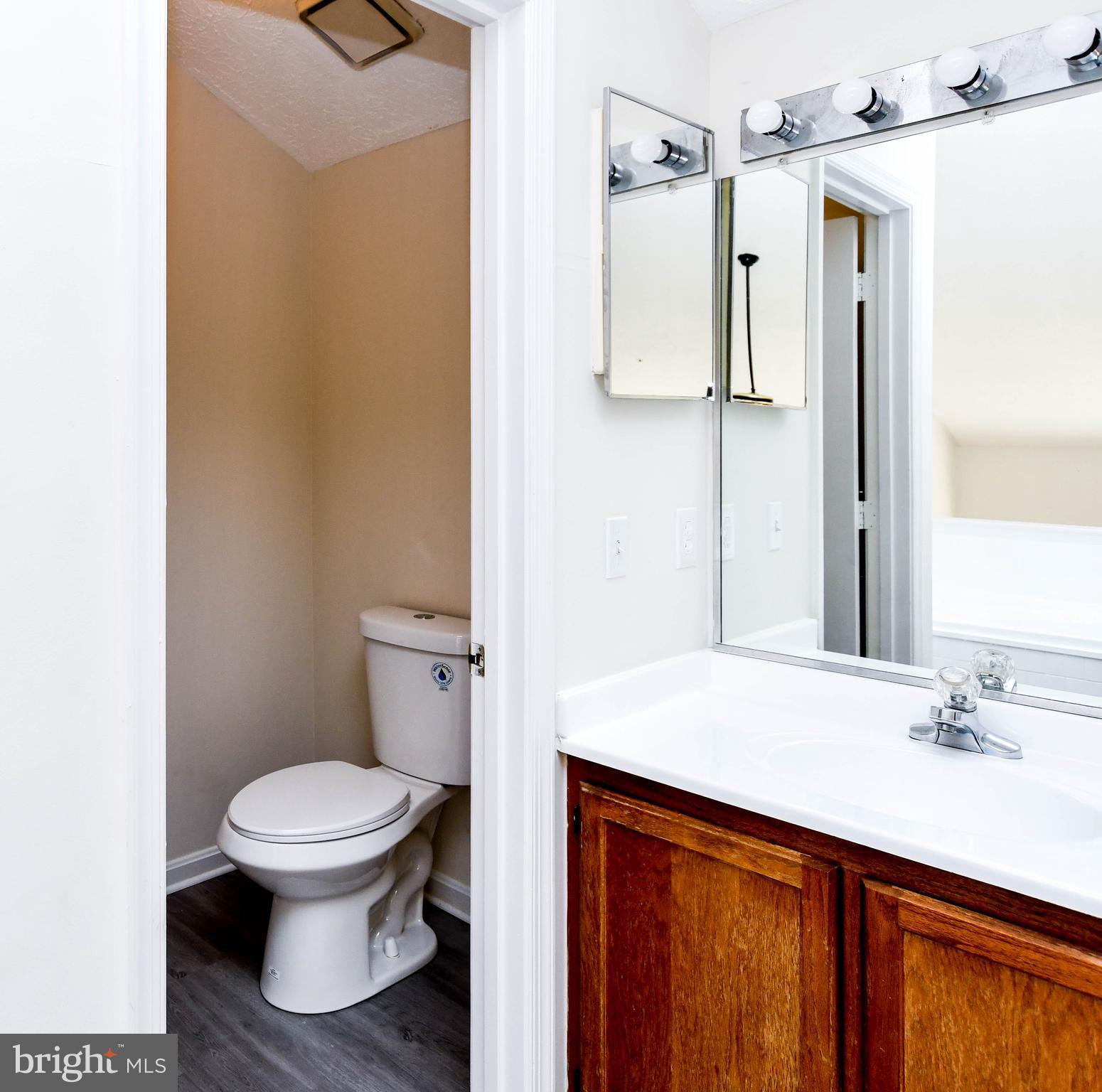 5908 Grenfell Loop Bowie, MD 20720 - Photo 51 of 65 a bathroom with a sink a toilet and shower