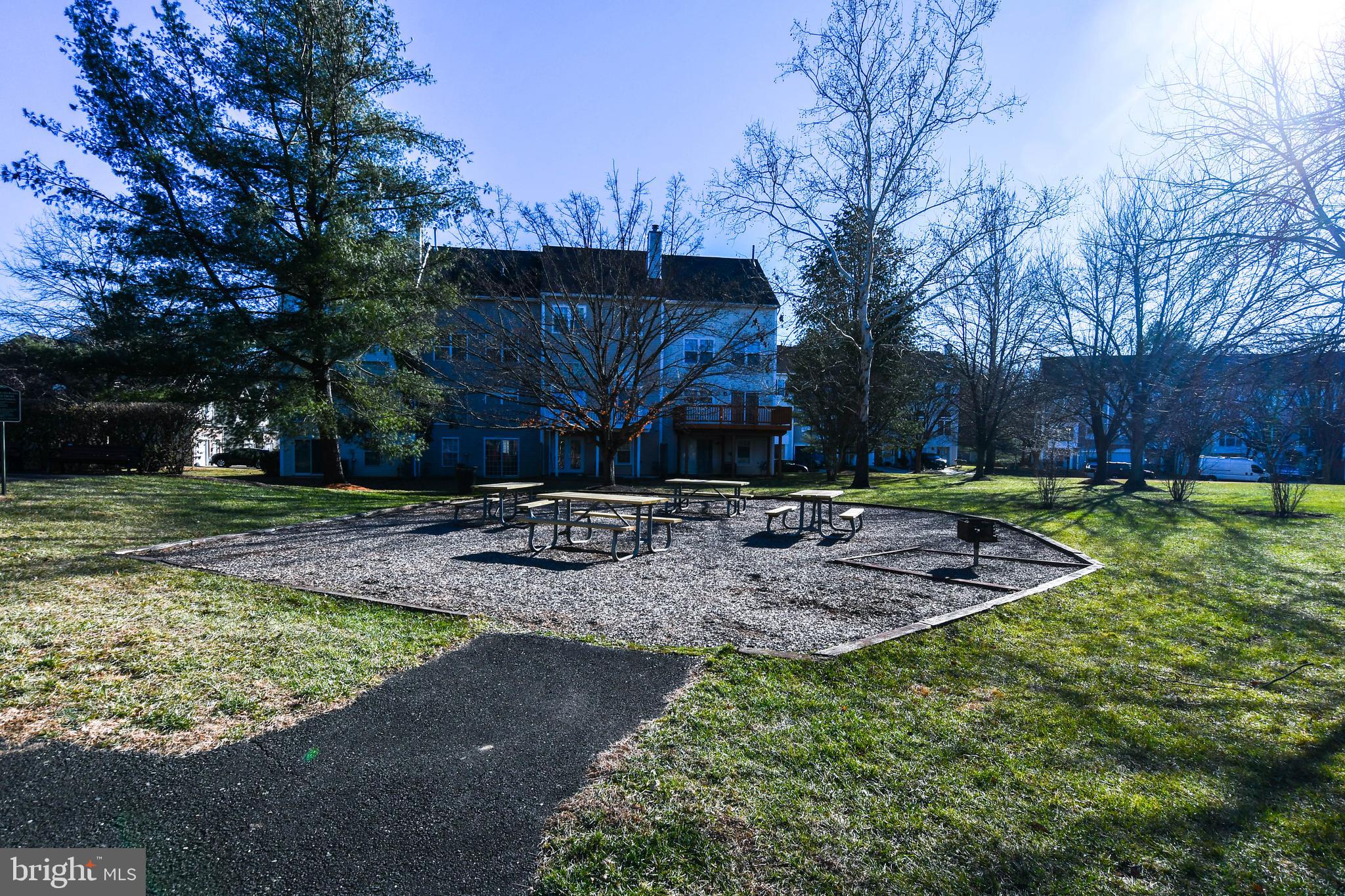 5908 Grenfell Loop Bowie, MD 20720 - Photo 57 of 65 a view of a backyard with large trees