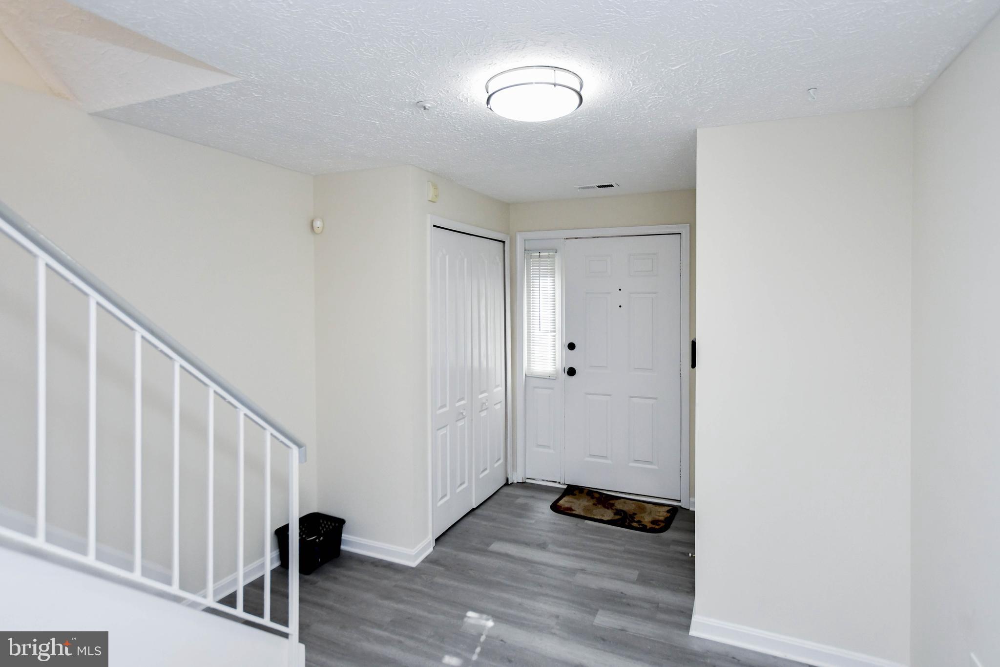 5908 Grenfell Loop Bowie, MD 20720 - Photo 6 of 65 a view of walk in closet with wooden floor