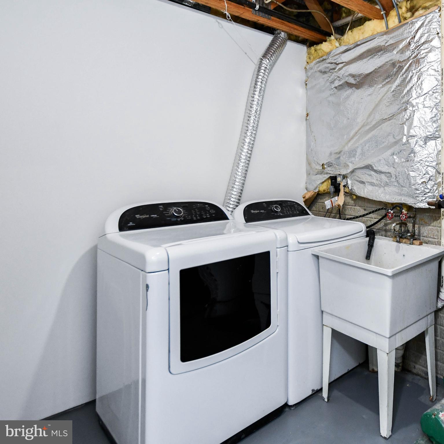 5908 Grenfell Loop Bowie, MD 20720 - Photo 7 of 65 a utility room with dryer and washer