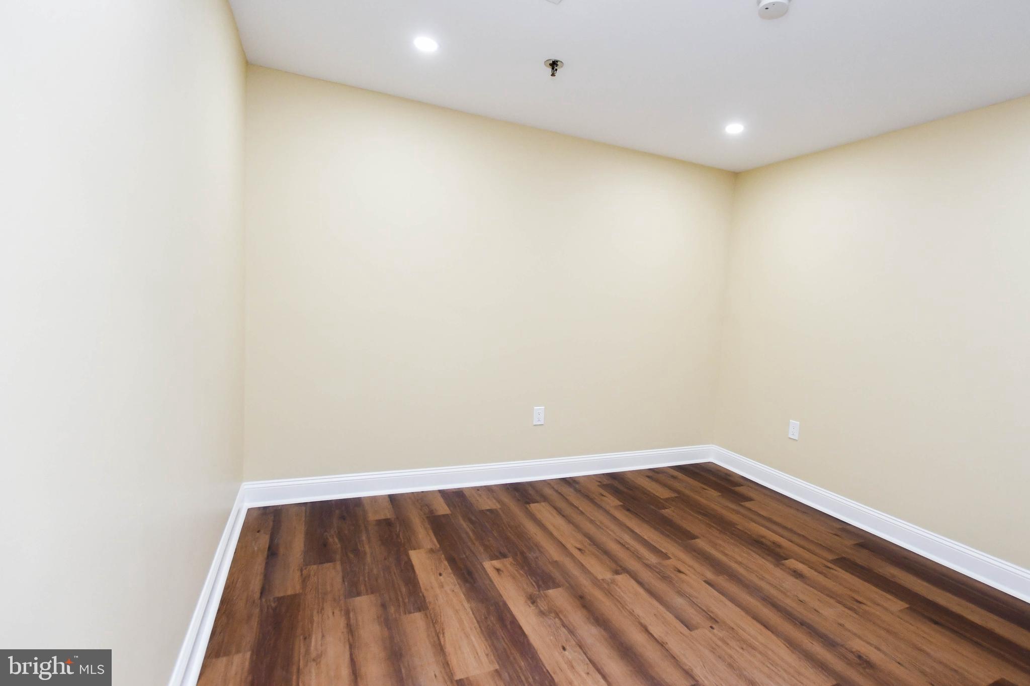 5908 Grenfell Loop Bowie, MD 20720 - Photo 8 of 65 a view of room with wooden floor and white walls