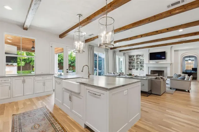 a kitchen with cabinets a sink and appliances
