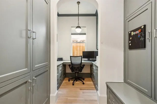 a view of a hallway with stairs