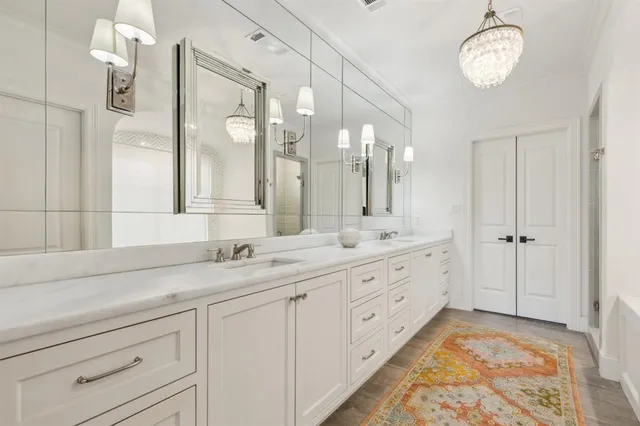 a bathroom with a tub and shower