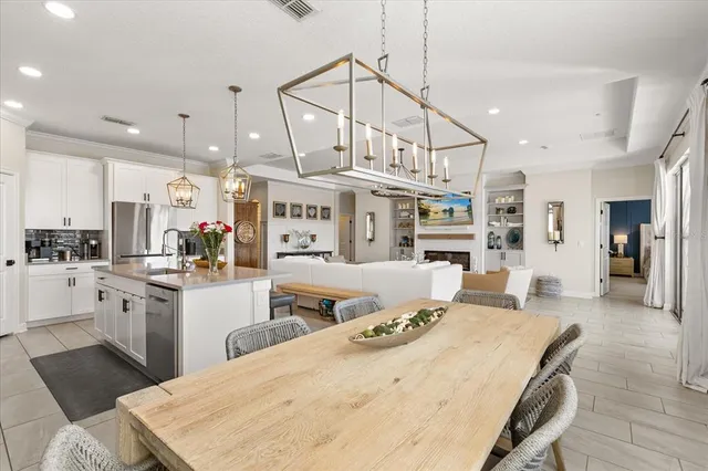 a view of a dining room with furniture and window