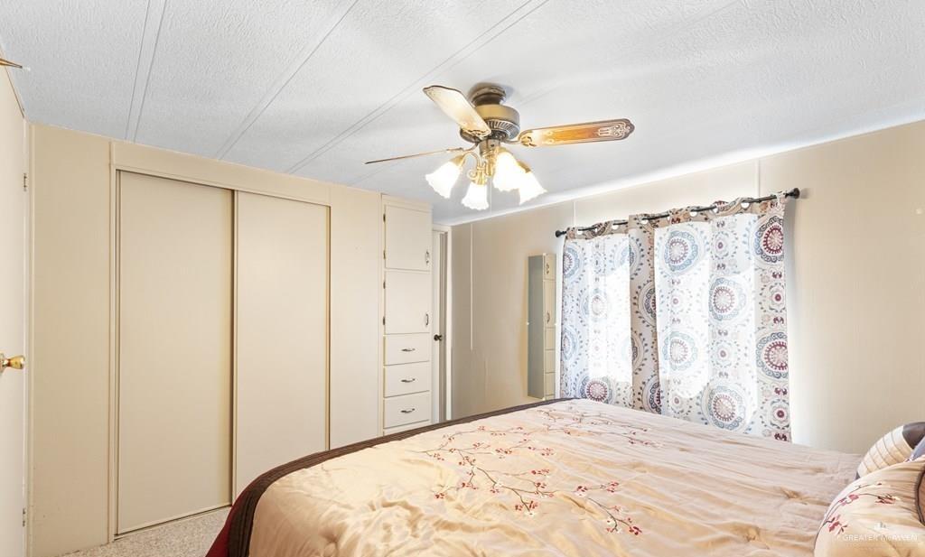 128 Apache Drive Harlingen, TX 78552 - Photo 11 of 17 a bedroom with a bed and a window