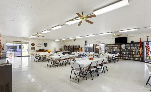 a view of a house with swimming pool and sitting area