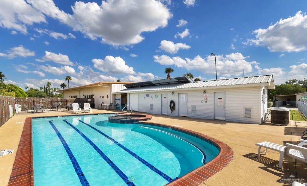 128 Apache Drive Harlingen, TX 78552 - Photo 16 of 17 a view of a house with swimming pool and sitting area