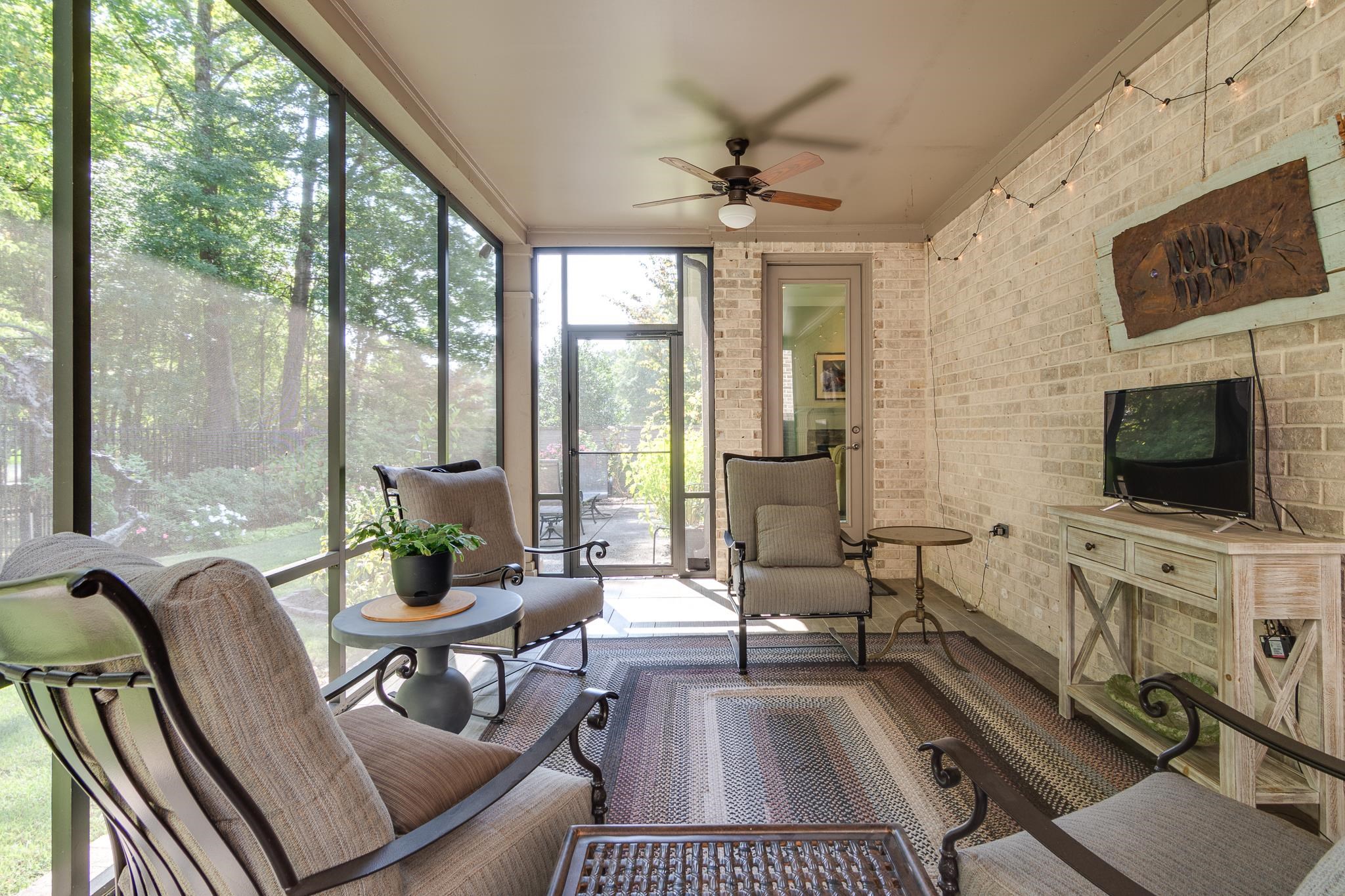 901 Colbert Street South Collierville, TN 38017 - Photo 27 of 37 Screen Porch with a ceiling fan