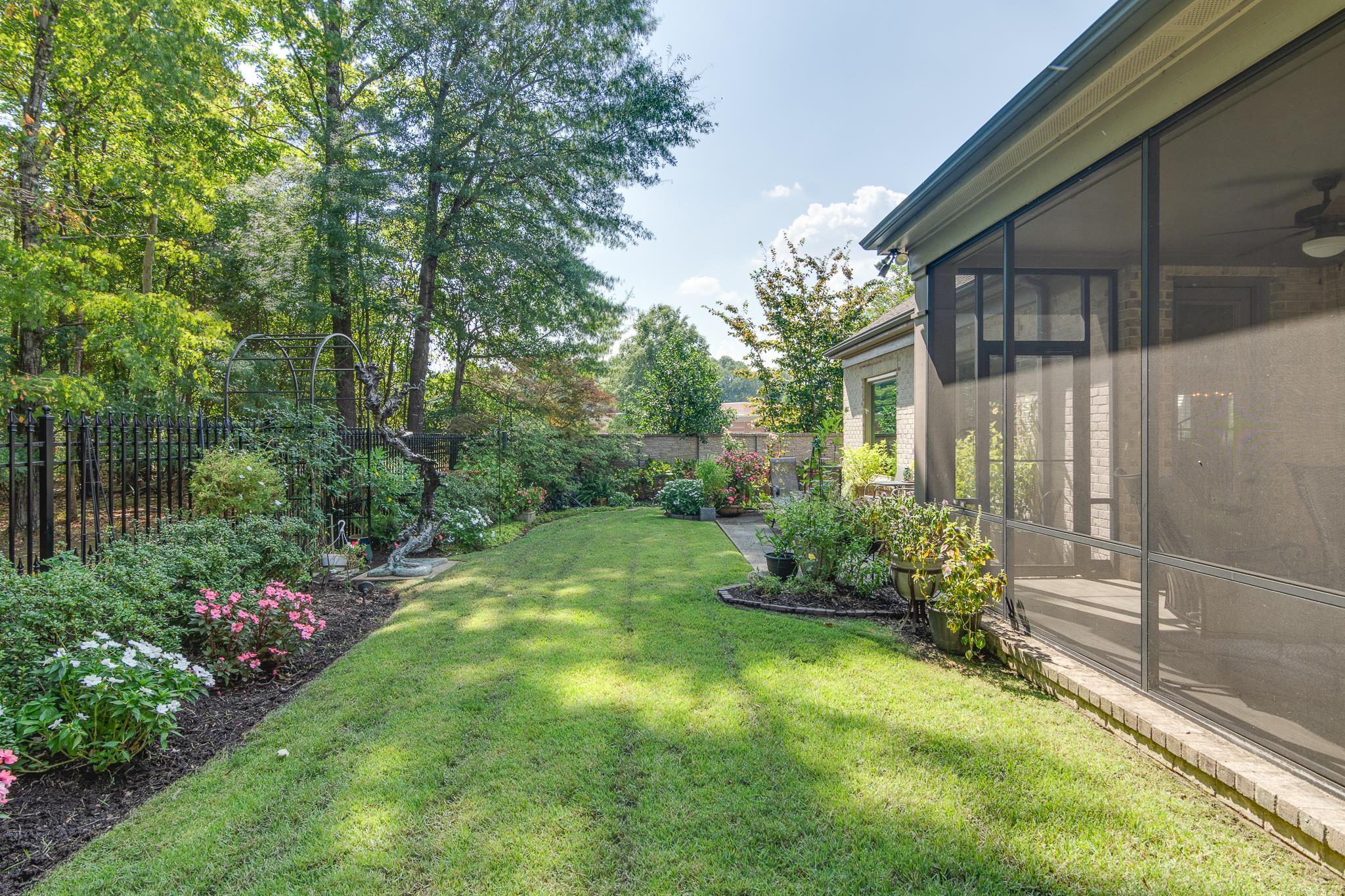 901 Colbert Street South Collierville, TN 38017 - Photo 33 of 37 Fenced backyard with a sunroom