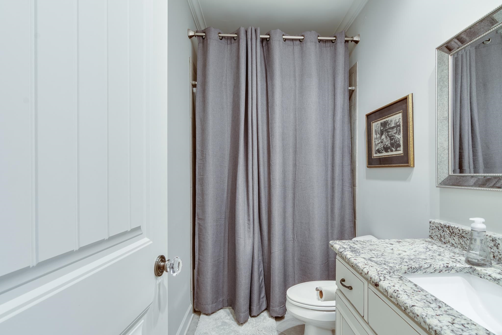 Bathroom with vanity and crown molding