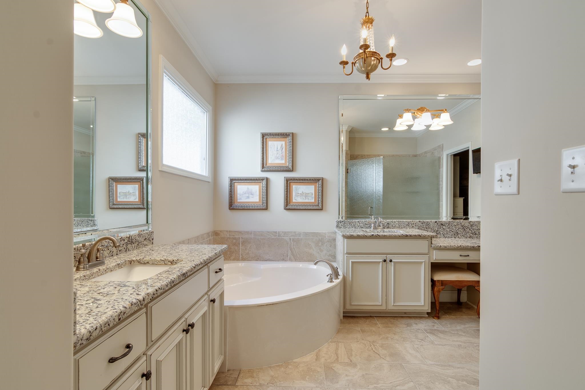 901 Colbert Street South Collierville, TN 38017 - Photo 8 of 37 Full bath with a chandelier, ornamental molding, a stall shower, two vanities, and a garden tub