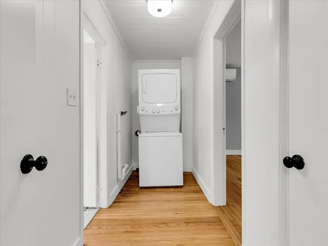 a view of a bathroom from a hallway
