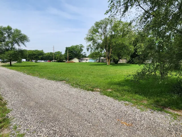 a view of a field with trees