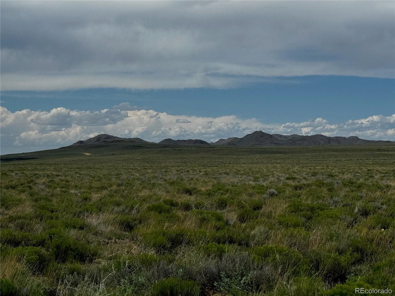 16 Harold Road San Luis, CO 81152 - Photo 14 of 15 a view of a lake with mountains in the background