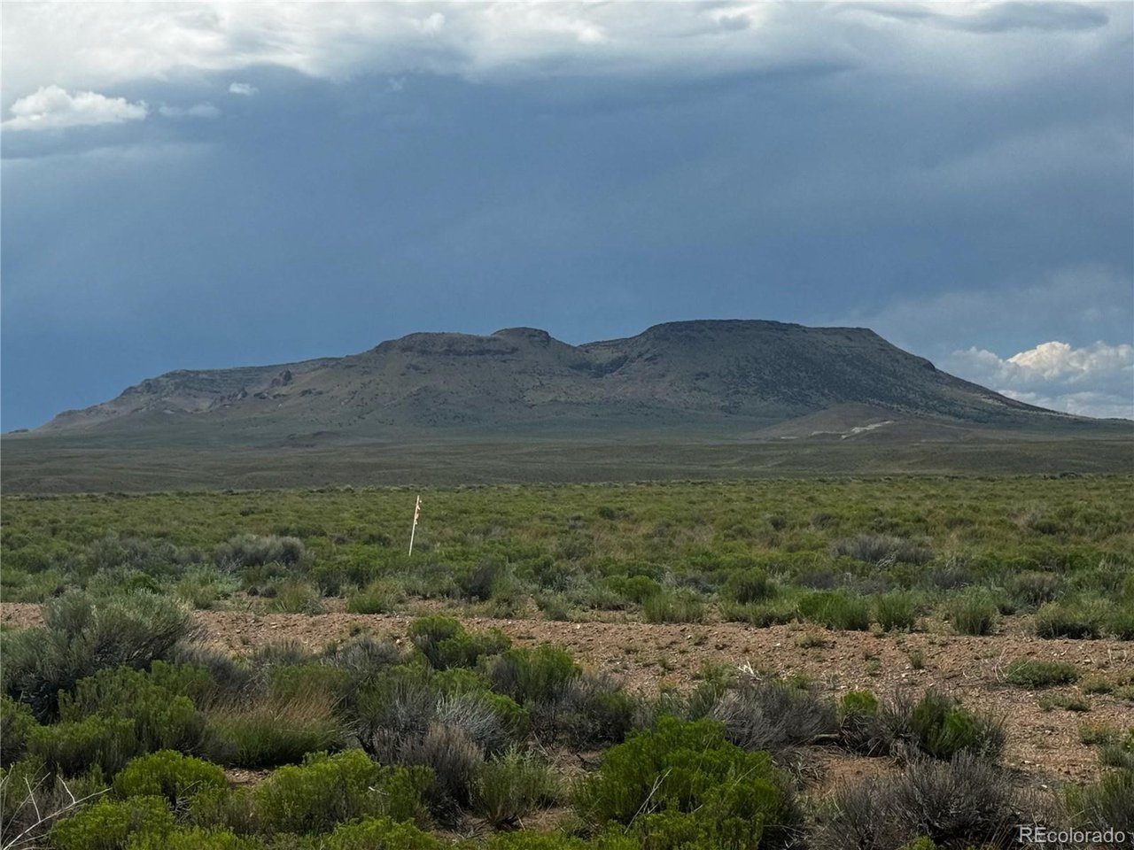 16 Harold Road San Luis, CO 81152 - Photo 9 of 15 a view of a mountain range with trees