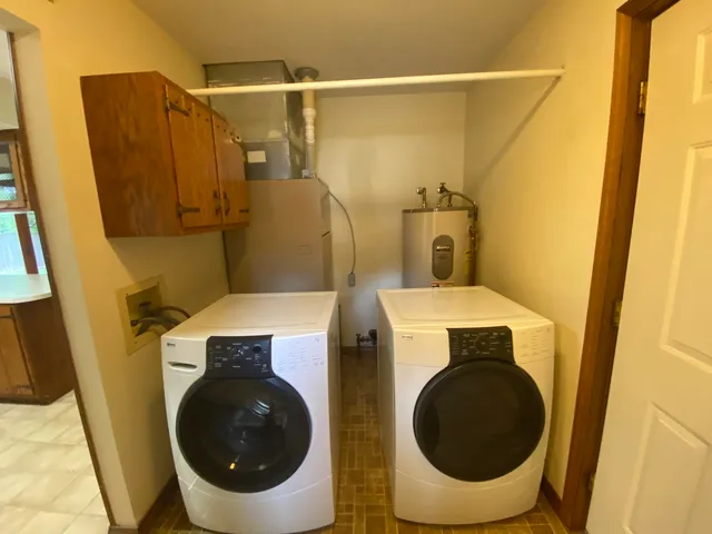 a bathroom with a granite countertop toilet sink and mirror