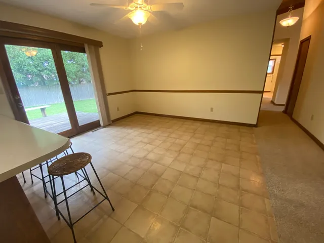 a kitchen with stainless steel appliances granite countertop a sink counter space cabinets and a large window