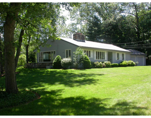 48 Winthrop Road Lexington, MA 02421 - Photo 1 of 1 a front view of a house with a yard and green space
