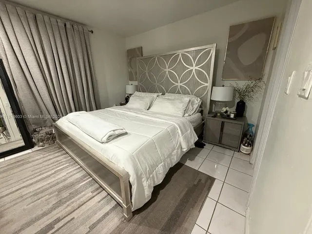 a bedroom with a bed and walk in closet