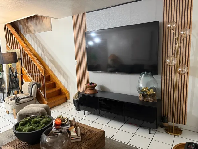 a room with lots of potted plants