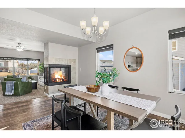 a view of a dining room with furniture and a mirror