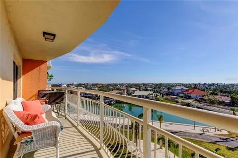 a view of a balcony with chairs