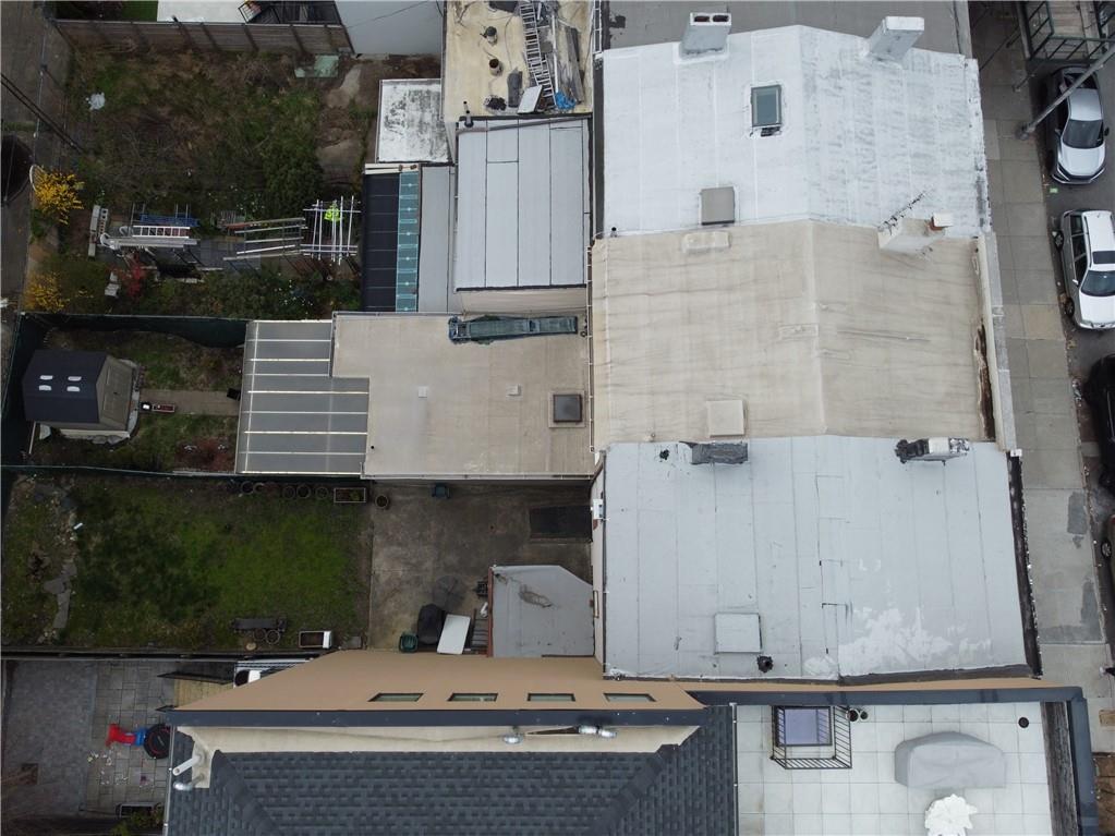 232 12th Street Brooklyn, NY 11215 - Photo 15 of 15 an aerial view of a house with a yard