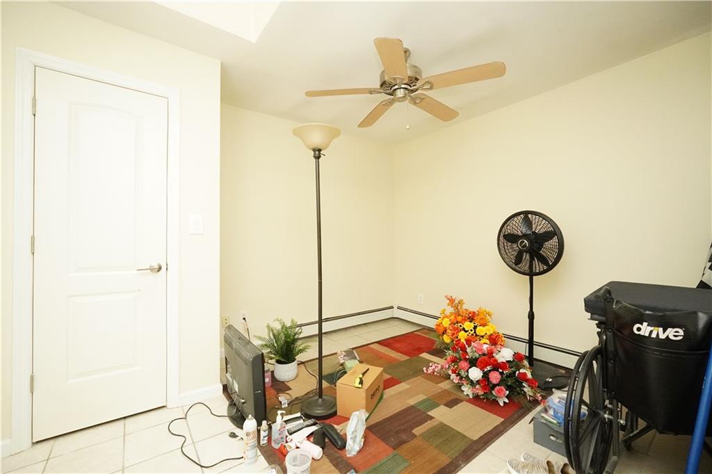 232 12th Street Brooklyn, NY 11215 - Photo 5 of 15 a table with a vase of flowers on it