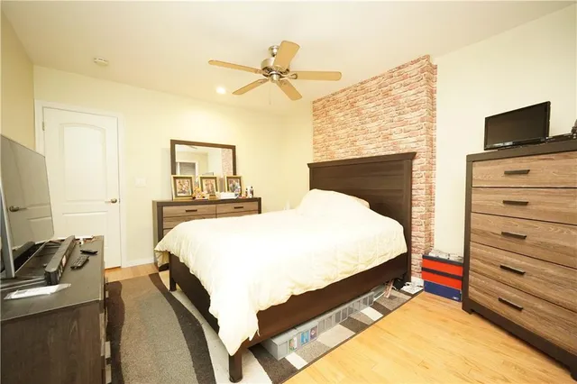 a bed room with a bed and a television