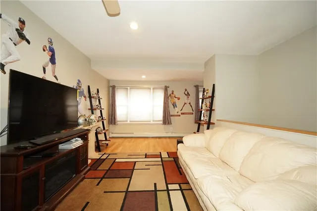 a living room with a flat screen tv and a couch