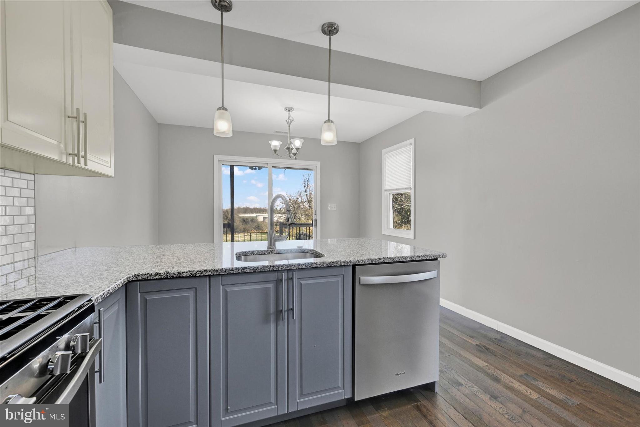 4604 Ridge Road Baltimore, MD 21236 - Photo 13 of 30 a kitchen with granite countertop a sink and a stove