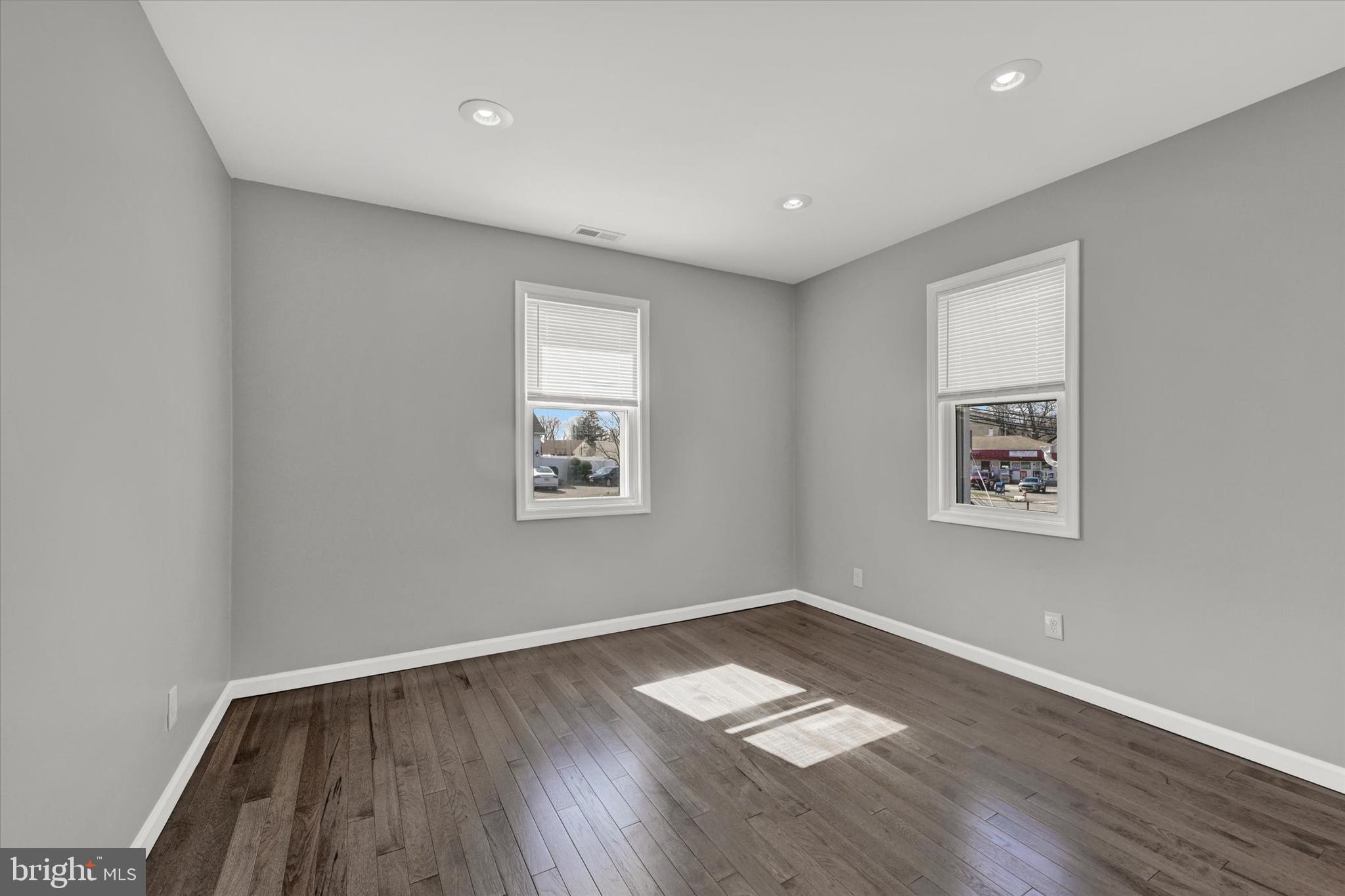 4604 Ridge Road Baltimore, MD 21236 - Photo 14 of 30 a view of empty room with wooden floor and fan