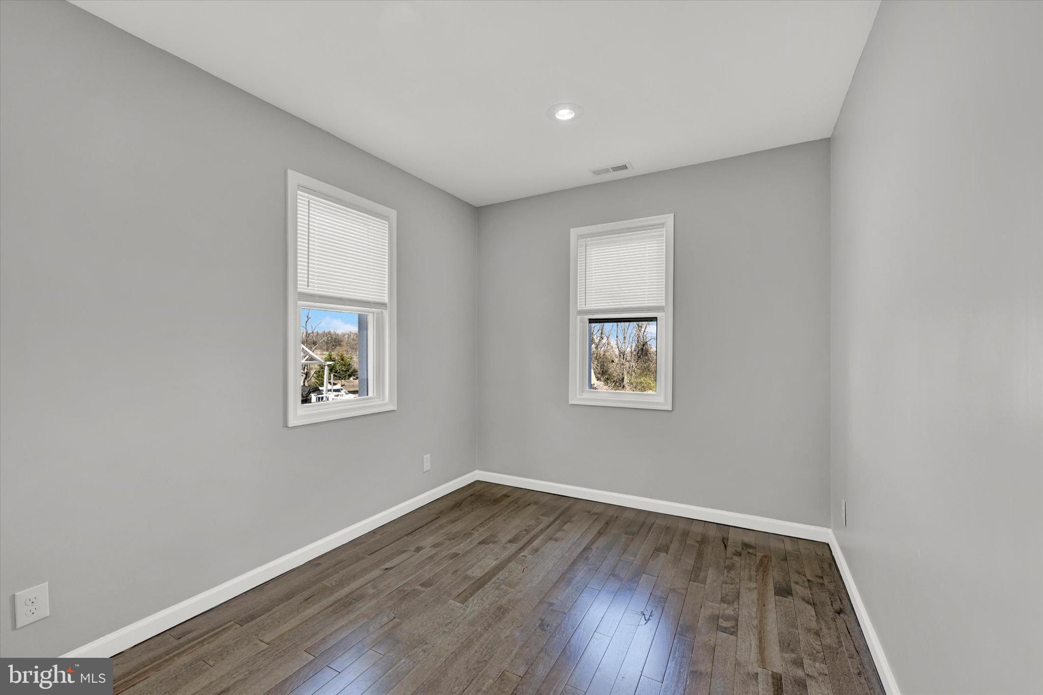 4604 Ridge Road Baltimore, MD 21236 - Photo 16 of 30 a view of empty room with wooden floor and fan