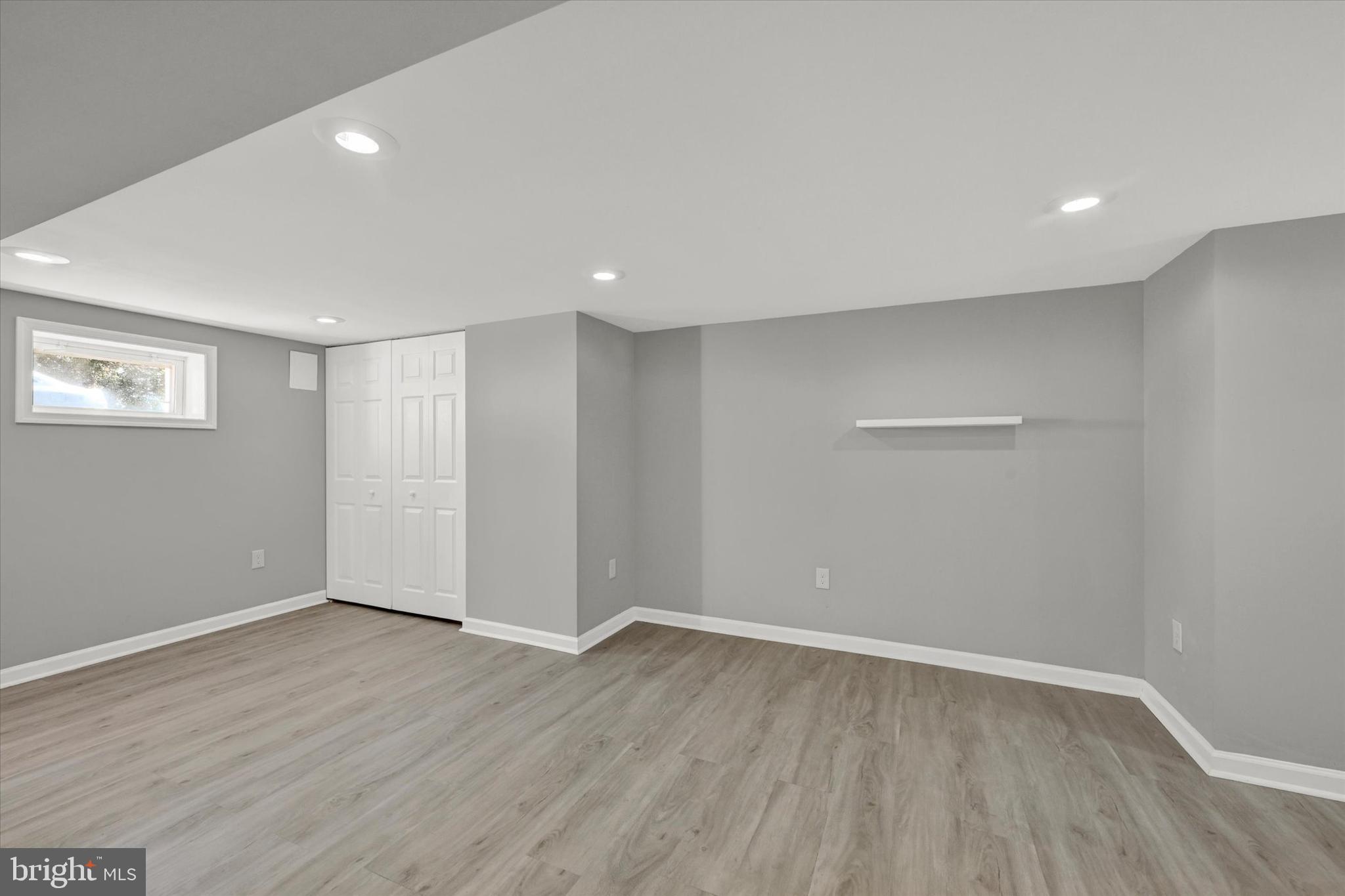 4604 Ridge Road Baltimore, MD 21236 - Photo 21 of 30 a view of an empty room with wooden floor
