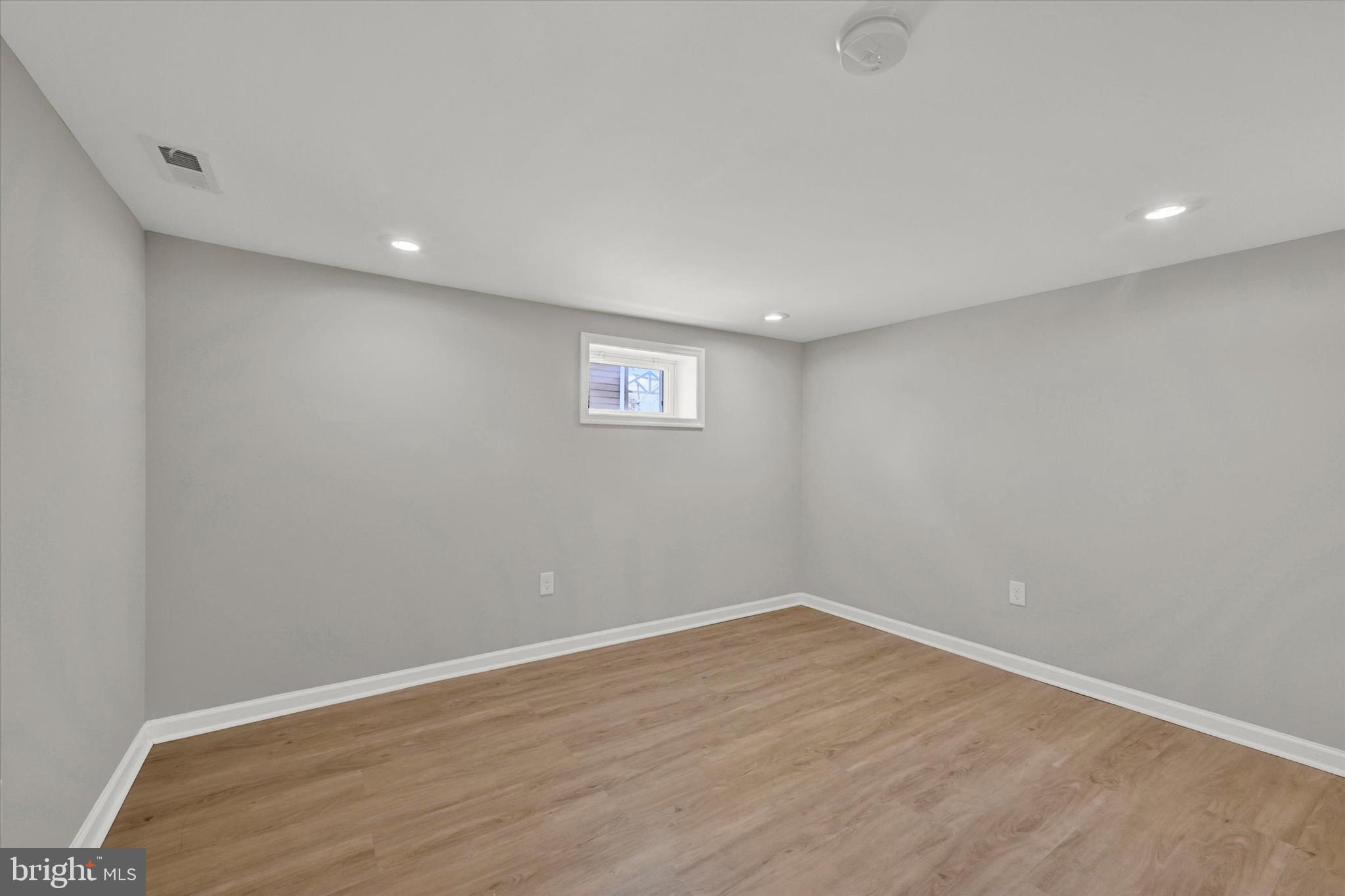 4604 Ridge Road Baltimore, MD 21236 - Photo 22 of 30 a view of a big room with wooden floor and windows