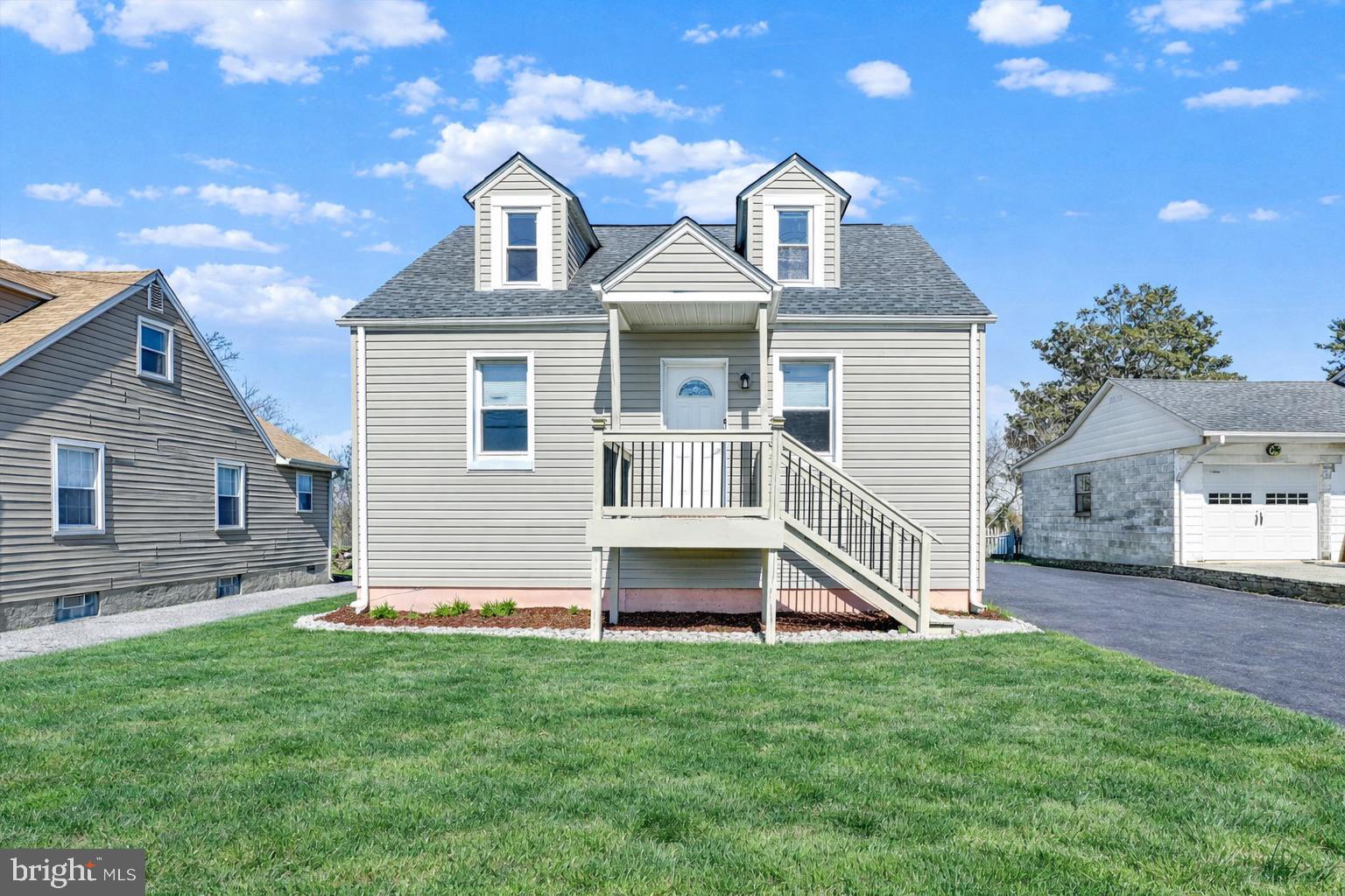 4604 Ridge Road Baltimore, MD 21236 - Photo 26 of 30 a front view of a house with a yard