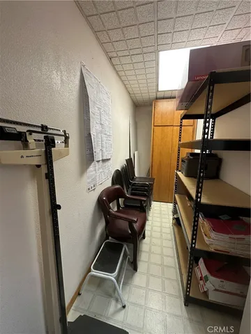 a kitchen with a sink a stove cabinets and a dining table