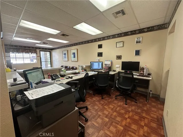 a view of workspace with wooden floor