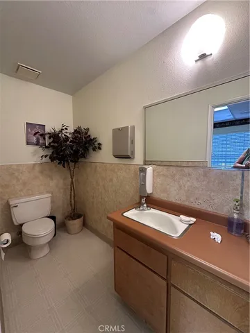 a living room with furniture a rug and a wooden floor