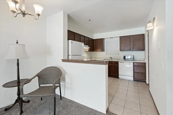 a kitchen with a sink a counter top space and appliances