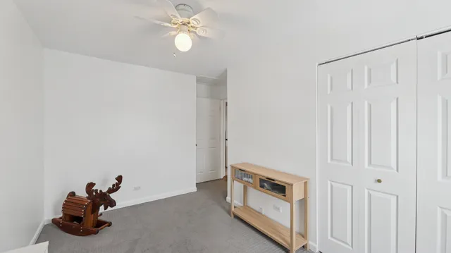 a view of a livingroom with a ceiling fan