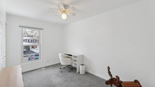 a view of a workspace with furniture