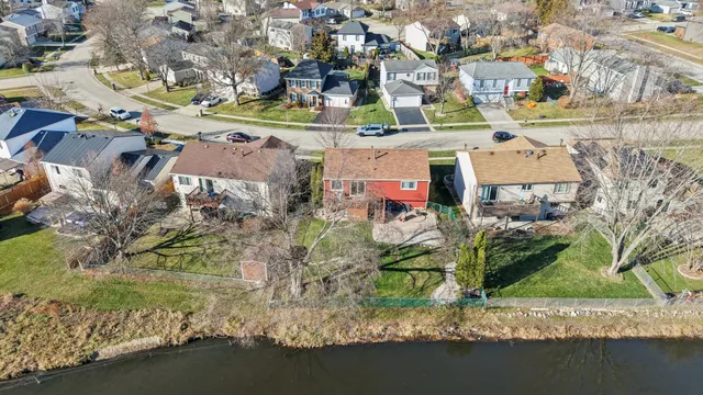 an aerial view of residential houses with outdoor space